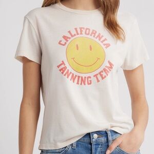 Re/Done California Tanning Team Happy Face Graphic Tee in Light Pink